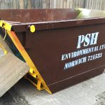 Skip with drop down doors