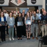 The 35 winners of the 35 Under 35 Award standing with certificates