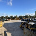 Outdoor view of skips and trucks on the PSH site